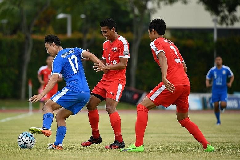 National footballer Juma'at Jantan (right) celebrated 10 years at S-League club Home United yesterday with a testimonial match at Bishan Stadium. Home took on Batch of 84, a team comprising players born in 1984, many of whom were his contemporaries a