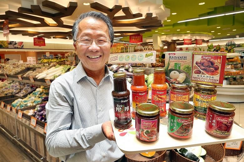 Sing Long managing director Ng Chin Nyan with products that he supplies to FairPrice. The scheme to help SMEs has reduced the need for the firm to take bank loans and this has helped it to save on interest costs.