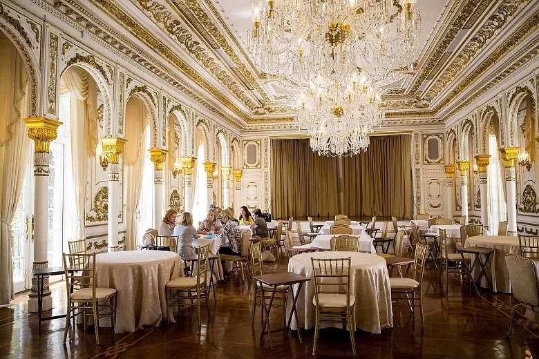 A portrait of Mr Trump hangs in the bar. The club was built by cereal heiress Marjorie Merriweather Post, who sold it to Mr Trump in 1985. Mar-a-Lago, Mr Trump's members-only Palm Beach, Florida, club, has been transformed into the part-time capital 