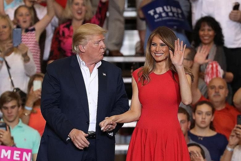 Mr Trump and his wife Melania at the rally, where the First Lady issued a scathing rebuke of his enemies and her critics.