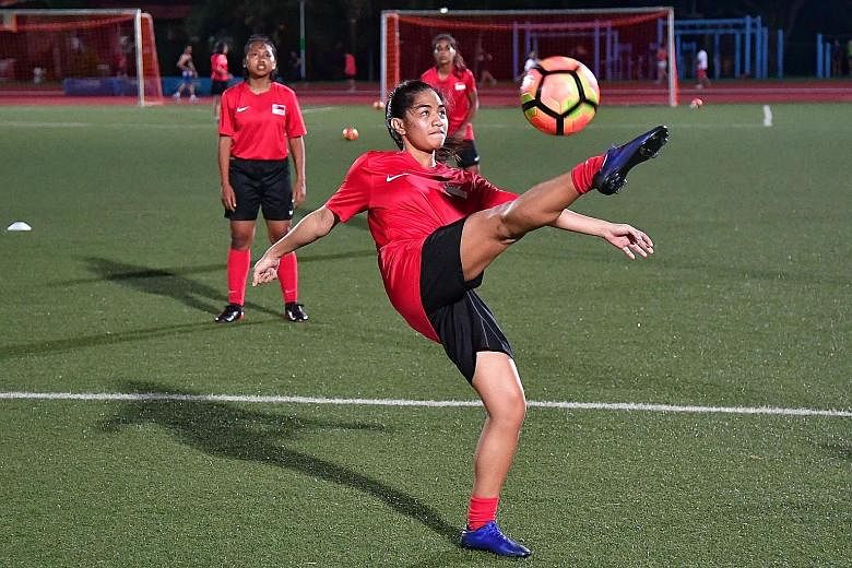 Stephanie Gigette Dominguez, 19, during training at Serangoon Stadium. The footballers need a decent run at the women's Asian Cup qualifiers to earn the approval of the SEA Games selectors.