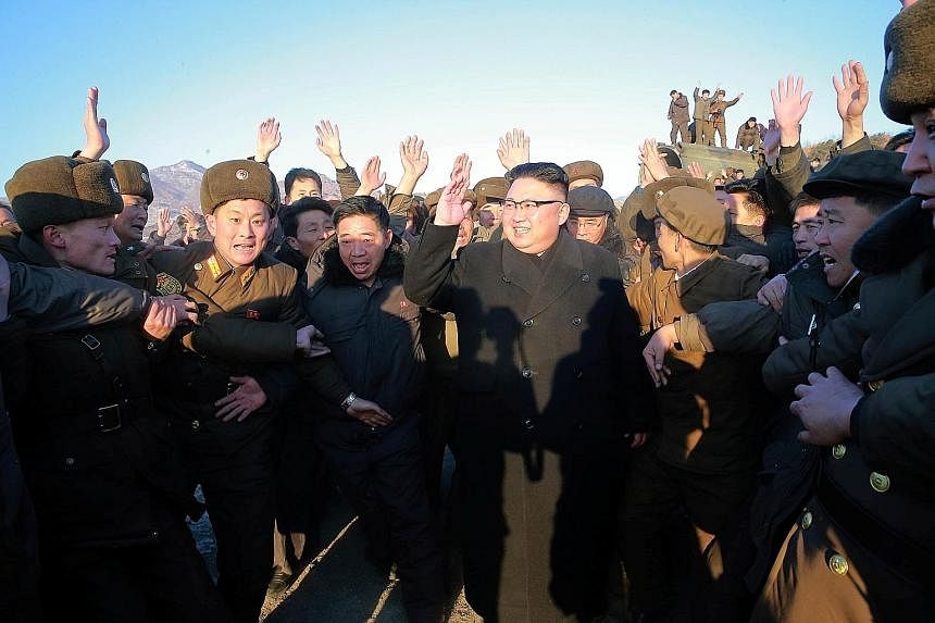 Mr Kim at the test-firing of North Korea's missile this month. There has been a change in Pyongyang's usually bombastic rhetoric since Mr Trump was elected US President.