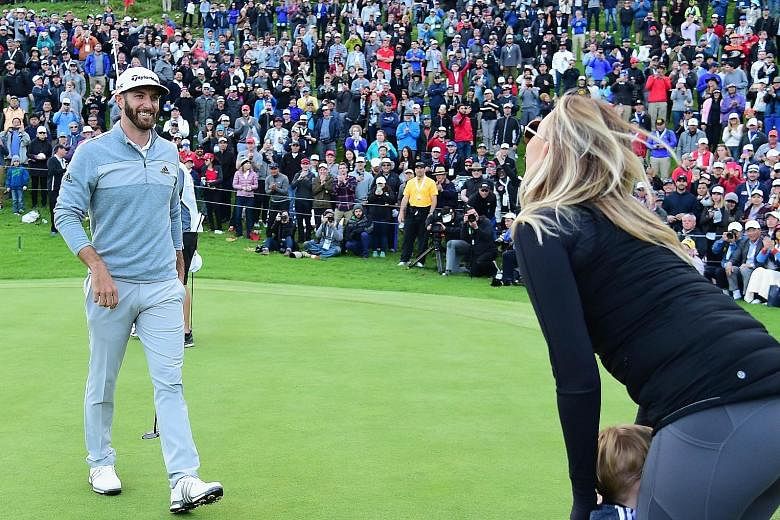 Dustin Johnson celebrating his Genesis Open win with fiancee Paulina Gretzky and son Tatum on the 18th green at Riviera Country Club in Pacific Palisades, California. He has taken the No. 1 spot from Australian Jason Day, who had held it for 47 weeks