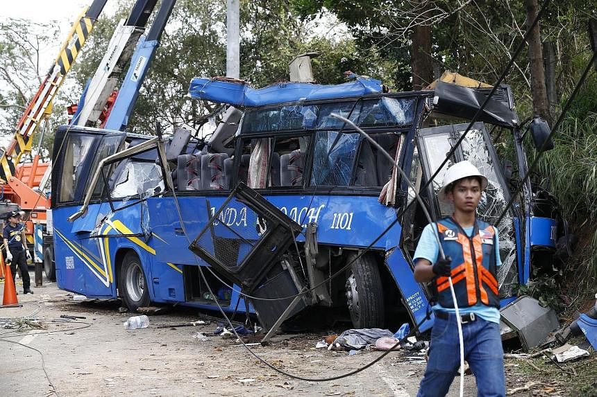 Fourteen college students on a camping trip were killed and dozens injured yesterday when their bus slammed into an electricity post in a mountainous area of the Philippines, police said. The bus was taking more than 50 teenage students and an instru