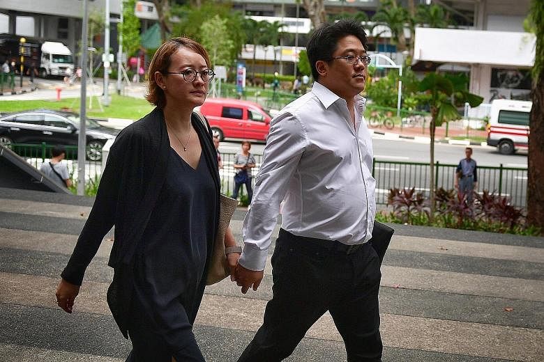 Ong Jenn arriving at the State Courts yesterday with his wife. He is on trial for two counts of engaging in a conspiracy with Mohamad Ismail to traffic cannabis.