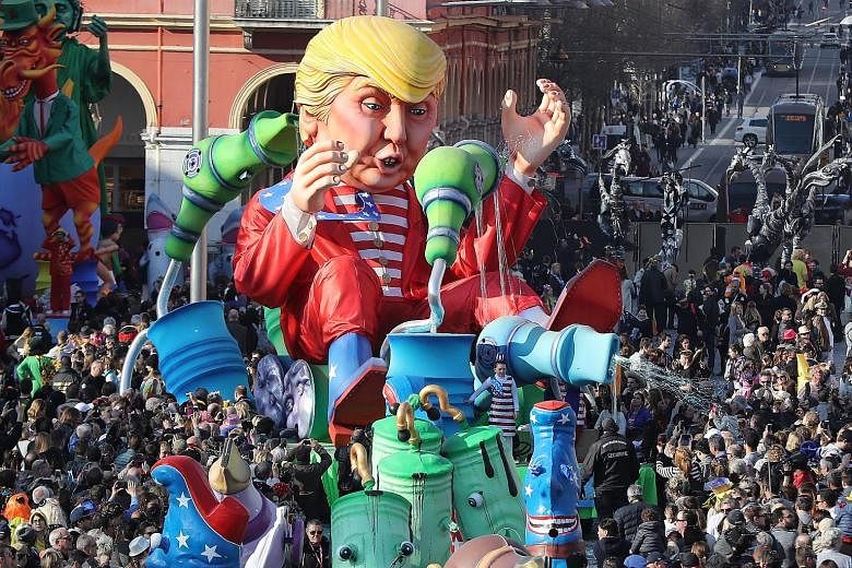A Donald Trump "Wind of Change" float at a parade during the Nice carnival in France over the weekend. Economists are watching the US' use of government data as President Trump bids to promote his economic policies. He and his advisers see the US goo