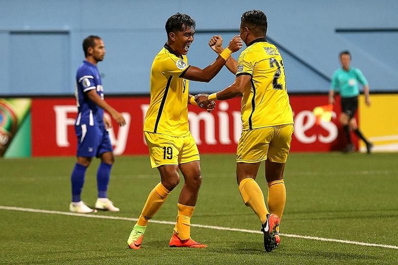 Tampines striker Khairul Amri celebrates his winner with team-mate Hafiz Rahim. He took 12 minutes to score the first goal of his third spell at the club.