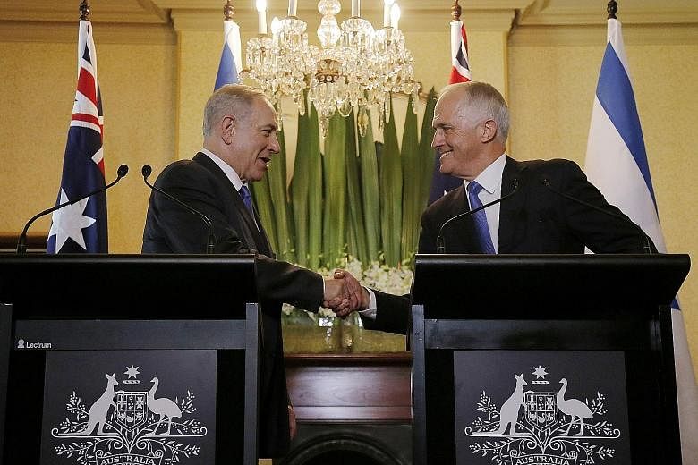 Mr Netanyahu (far left) and Mr Turnbull at their joint press conference in Sydney yesterday. The Israeli PM is on a four-day visit to Australia.