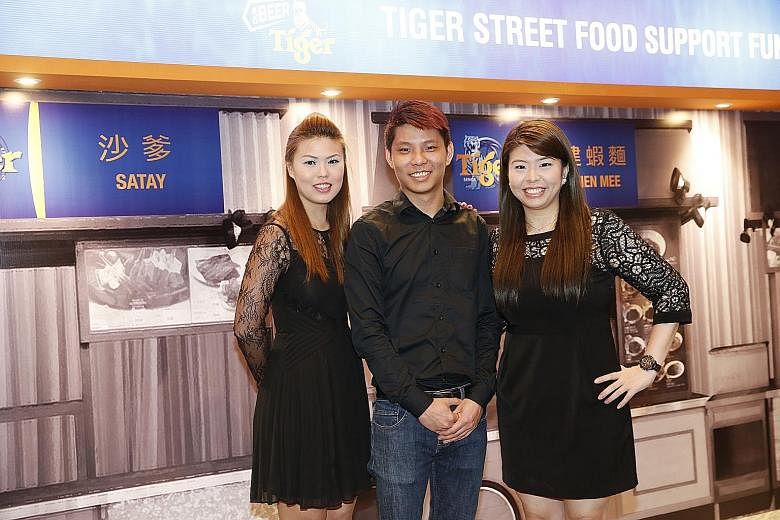 Mr Glen Liang, who runs a Nonya laksa stall with his sisters Sabrina (left) and Audrey, is one of the grant recipients.