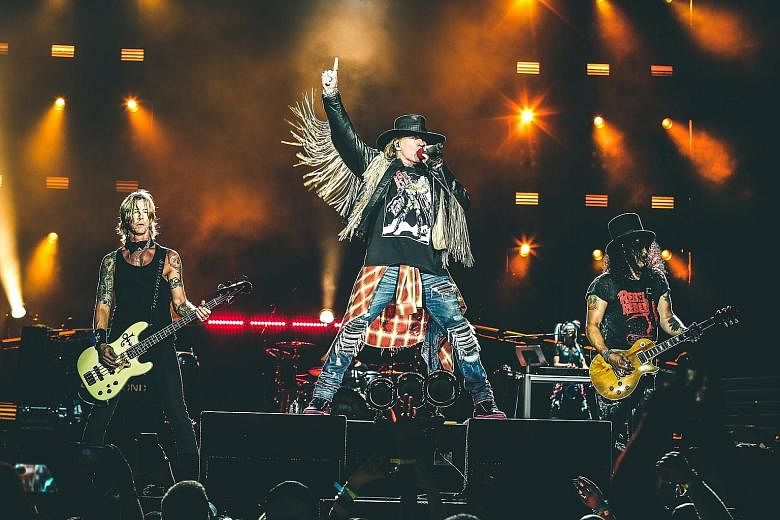 Guns N' Roses' (from left) bassist Duff McKagan, singer Axl Rose and guitarist Slash will be performing tomorrow at Changi Exhibition Centre.