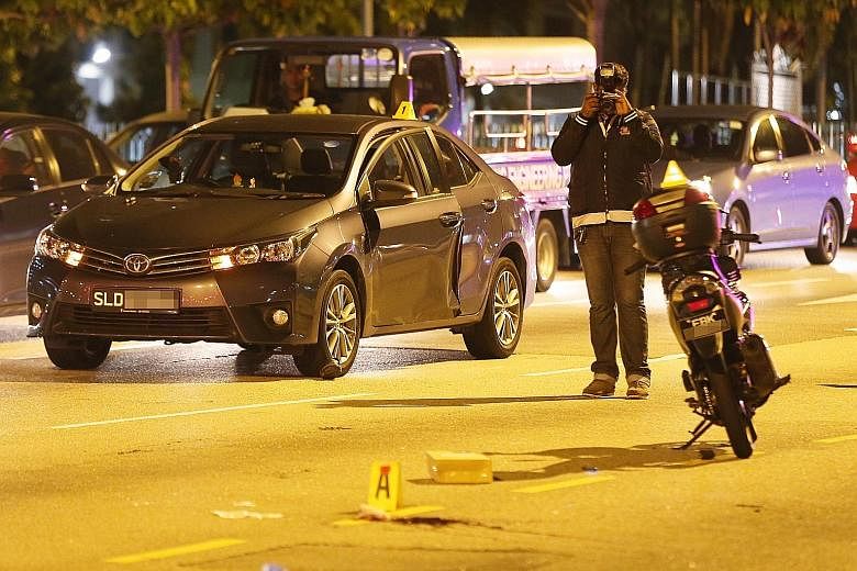 The scene of the accident along Ang Mo Kio Avenue 3 towards Ang Mo Kio Avenue 1. The passenger of the black Toyota was arrested.