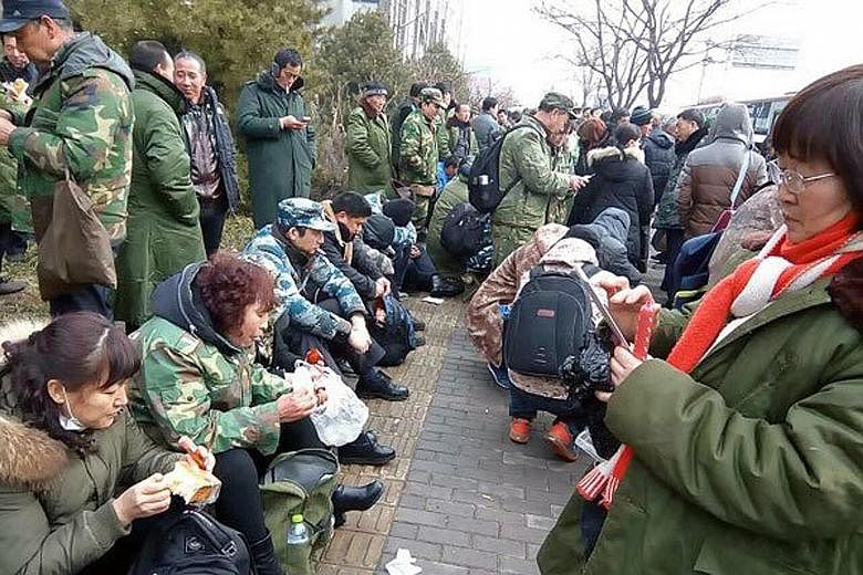 People's Liberation Army veterans gathering to protest outside the government disciplinary commission in Beijing on Wednesday. The rally is the largest within the city's limits since a rally last October.