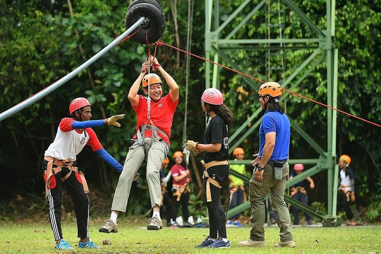 Mr Ng on the flying fox yesterday at the OBS' Pulau Ubin facility, where 350 students from two schools were at the camp.