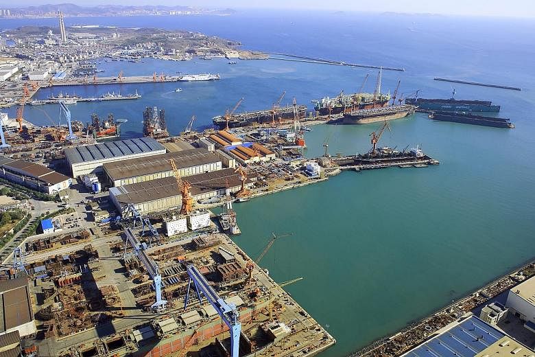 China Cosco Shipping Corp says it will buy out the shipyard businesses of its Singapore-listed unit Cosco Corp, including its equity interests in Cosco (Dalian) Shipyard (above).