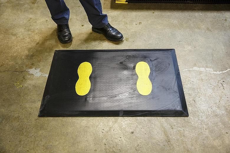 One of the mats made at the SmartCells factory in Chehalis, Washington, intended to reduce fatigue for Boeing workers on their feet while assembling jets. President Trump's talk of border tariffs and new trade deals has the US aerospace industry worr