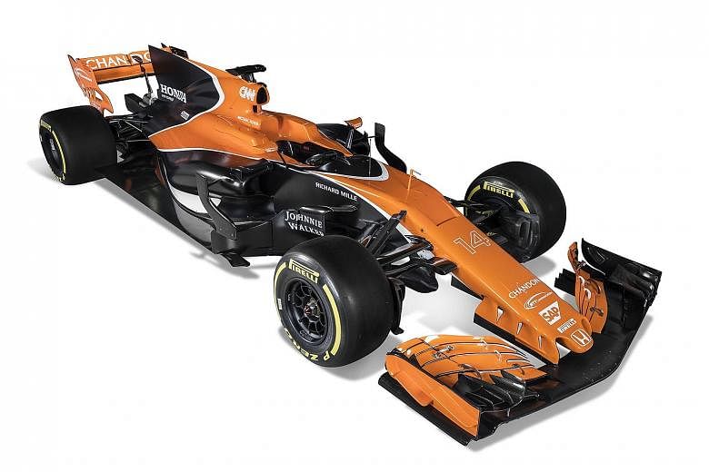 McLaren's new-look model has a longer nose and features a retro colour scheme of orange and black.