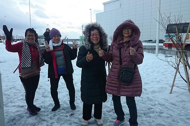 (From left) Madam Loh, Madam Teo, Madam Tham and Madam Peh experienced snow for the first time yesterday after arriving in Hokkaido. They will be there until Thursday, courtesy of Scoot which sponsored their air tickets, and Klook which sponsored the