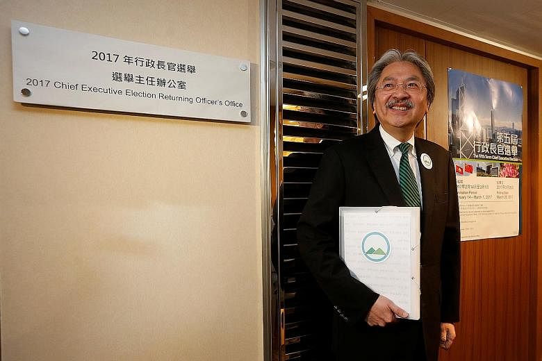 Former Hong Kong financial secretary Mr Tsang was the first to submit his nomination forms yesterday as a candidate for Hong Kong's chief executive post. Mrs Lam, Beijing's preferred candidate, is expected to submit her forms on Tuesday.