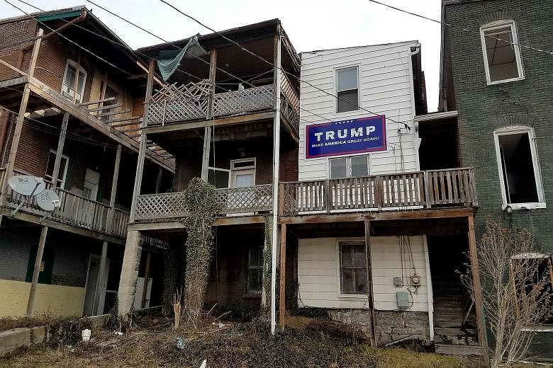 One of the two methadone treatment centres for heroin addicts in Cumberland, Maryland (left) and a Trump sign displayed in the area (above). President Trump has promised to expand "drug courts" where addicts are closely supervised, and to equip first