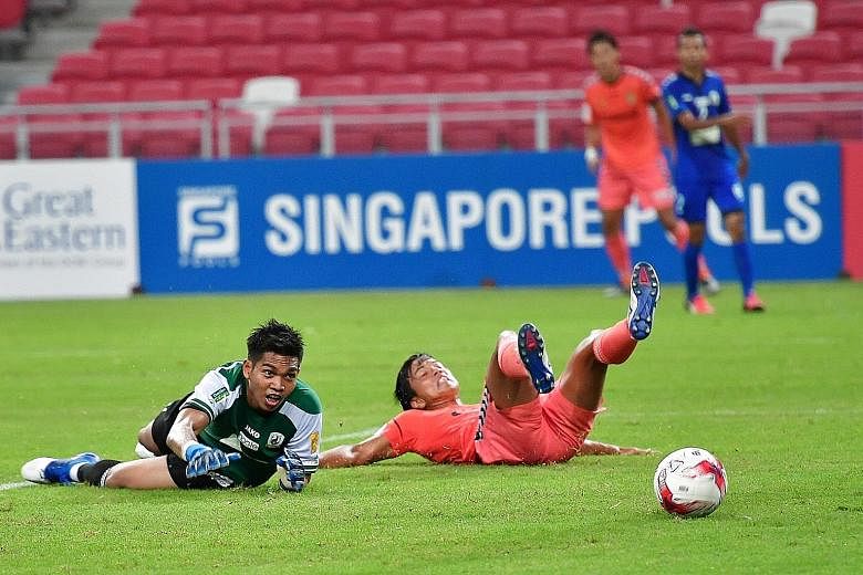 Tampines goalkeeper Izwan Mahbud watching in vain as this attempt by substitute Shoichiro Sakamoto, who had equalised at 1-1, beats him and rolls into the net for what turned out to be the winning goal for Albirex, who retained the Community Shield.
