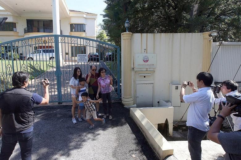 The front gate of the North Korean Embassy, located in the upscale Damansara Heights, just outside downtown Kuala Lumpur, has become a magnet for onlookers to snap pictures. They join journalists who have parked themselves there after the deadly atta