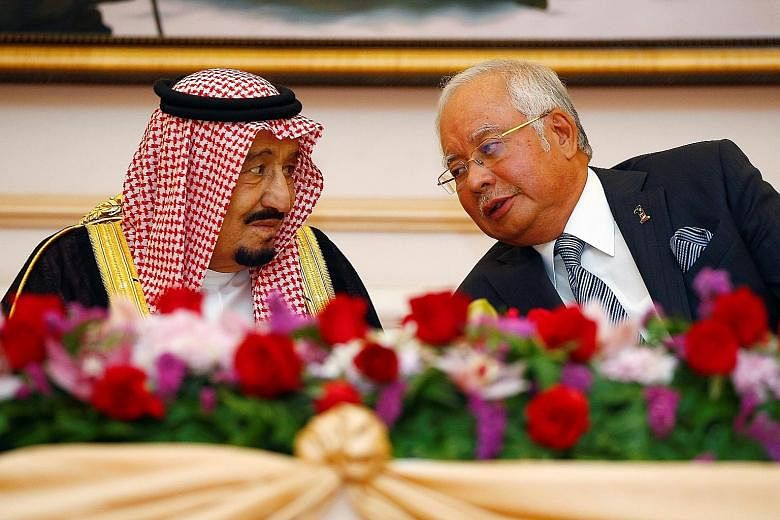King Salman and Prime Minister Najib at a ceremony yesterday to mark the signing of memorandums for cooperation on economic, labour, science and education issues.
