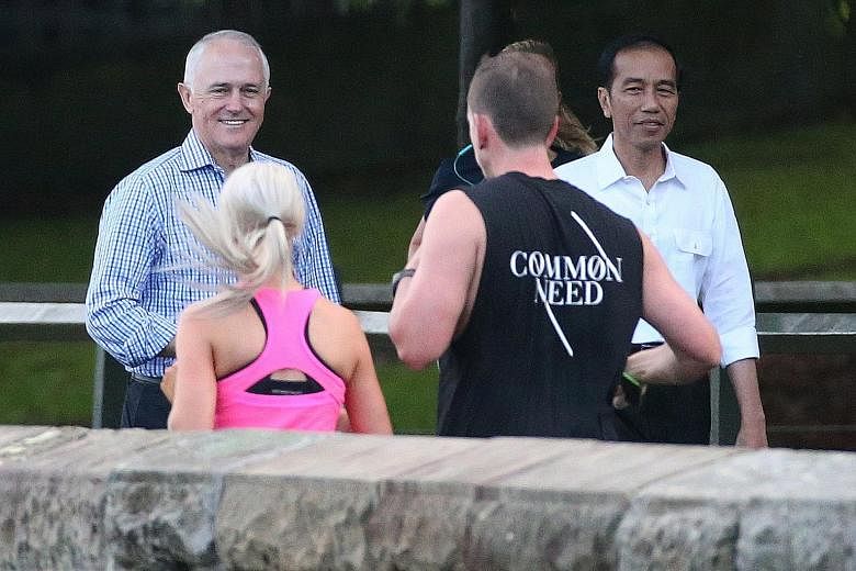 Australian Prime Minister Turnbull strolling in Sydney with Indonesian President Joko Widodo on Sunday. Mr Turnbull has struggled to satisfy his party's conservative wing, which is weighing a more right-wing stance on issues such as immigration to wi