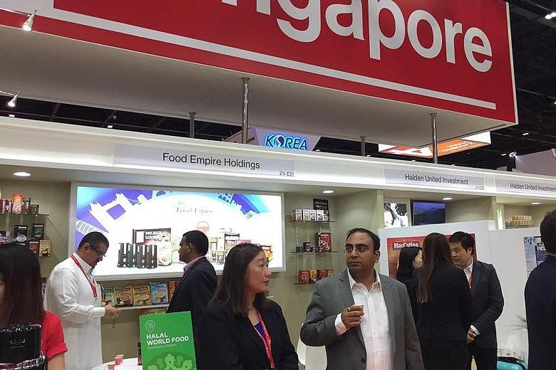 Representatives of Singapore's food manufacturers showcasing their products at the Gulfood 2017 exhibition in Dubai. The Middle East is a key market for Singapore food, with US$52 billion in sales expected this year.