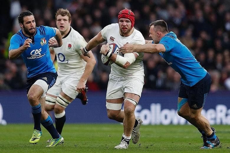 Italy's Simone Favaro (right) tackles fellow flanker James Haskell of England during their Six Nations clash at Twickenham. Haskell and skipper Dylan Hartley tried to ask the referee about the rules of the game during England's 36-15 victory on Sunda