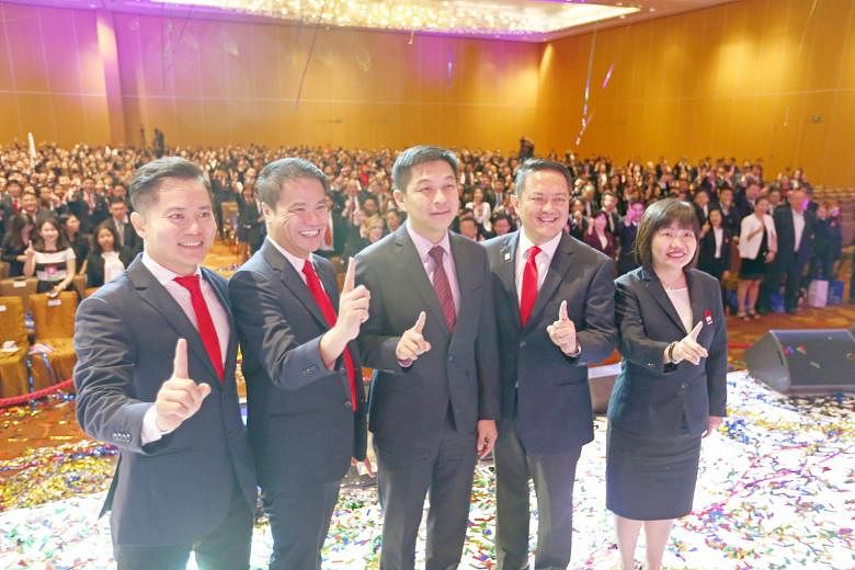 Mr Tan (centre) posing for a group shot at the ERA conference yesterday with (from left) Mr Chu, Mr Chua, key executive officer Eugene Lim and chief operating officer Doris Ong.