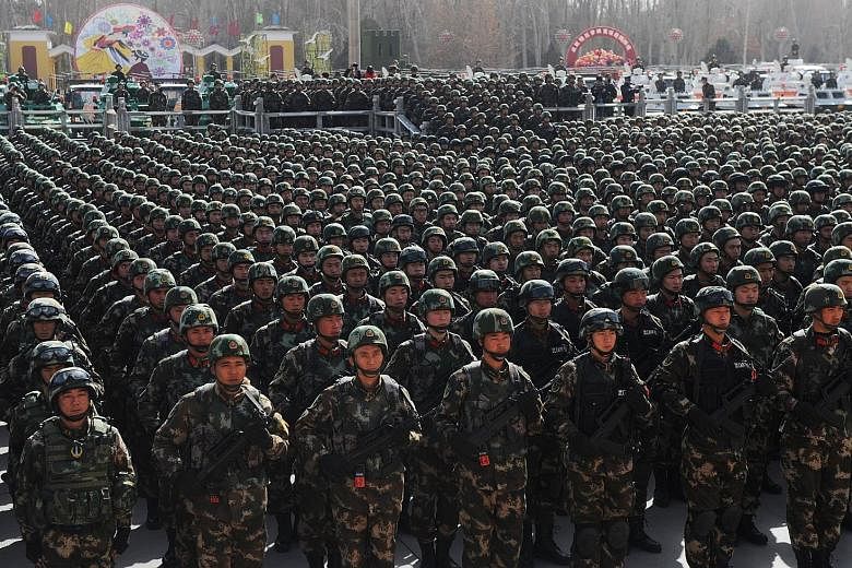 Chinese paramilitary forces at an anti-terror rally in Xinjiang. The Uighur homeland has been the site of persistent clashes between the Han and Uighurs, who complain of repression and discrimination. An expert says this video marks the first time Ui