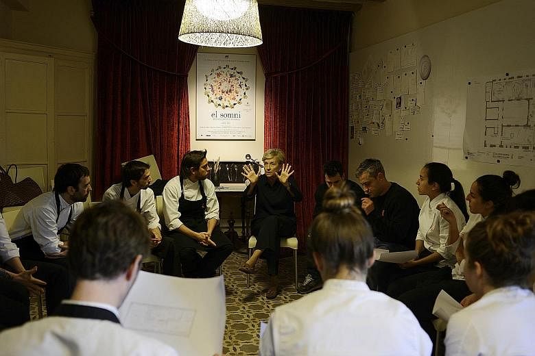 Psychologist Imma Puig (centre) at a group therapy session at Spanish restaurant El Celler de Can Roca.