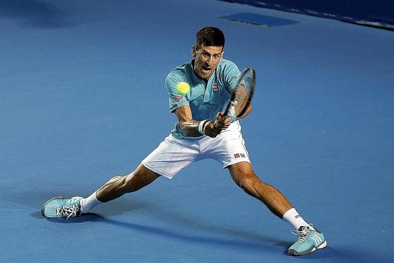 World No. 2 Novak Djokovic stretches to hit a backhand against Slovak Martin Klizan at Acapulco. The Serb hit just nine winners in his straight-sets win - 16 fewer than Klizan. But he made only 11 unforced errors, compared to 30 by the southpaw.