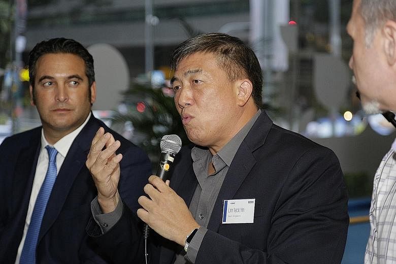 SportSG chief executive officer Lim Teck Yin speaking at KPMG's inaugural Business of Sport Network event, which was an opportunity for sports business professionals to network. Beside him is Fox Networks Group Asia executive vice-president Italo Zan