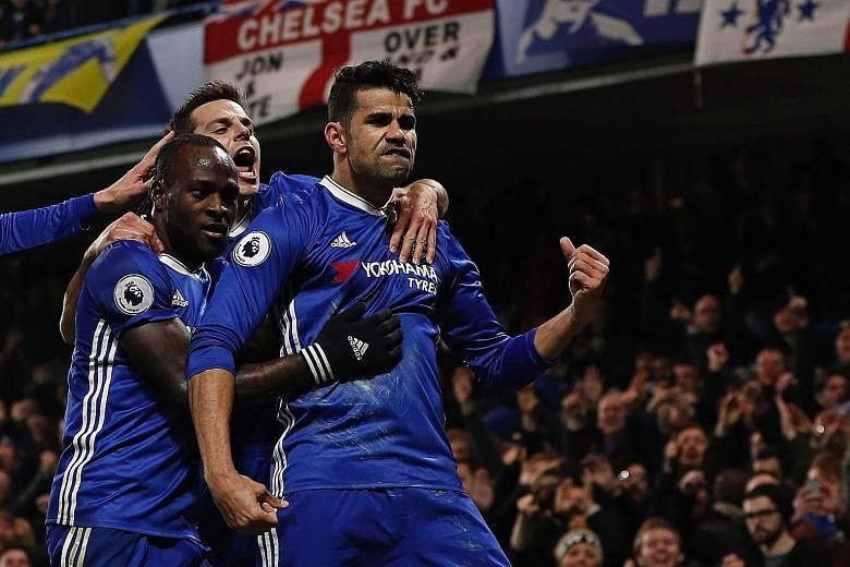 Striker Diego Costa (right), Chelsea's top scorer this season, celebrating one of his 16 Premier League goals this term. The Blues will play Premier League rivals Arsenal in Beijing on July 22 and could feature in Singapore that month.