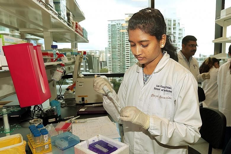  PhD student Divya Gunaseelan, 27, at one of the new facility's research labs where fourth-year students can undertake a six-week scholarly project module, during which they work alongside clinicians and researchers.