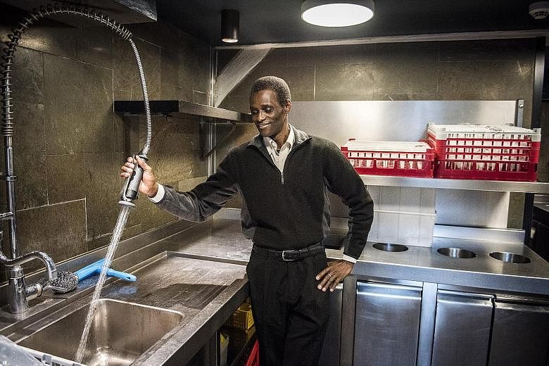 Mr Ali Sonko, who was a farmer in Gambia, in the kitchen of Noma restaurant in Copenhagen.