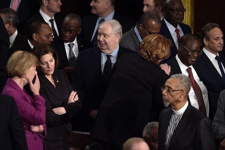 Mr Sergey Kislyak (centre) arriving before Mr Donald Trump addressed a joint session of Congress on Tuesday.