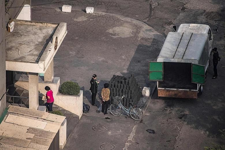 A shipment of coal brickettes in Pyongyang. China says its ban on coal imports from North Korea is in line with UN sanctions against the hermit state. Pyongyang's ban on mineral exports to China is only temporary, said a source.