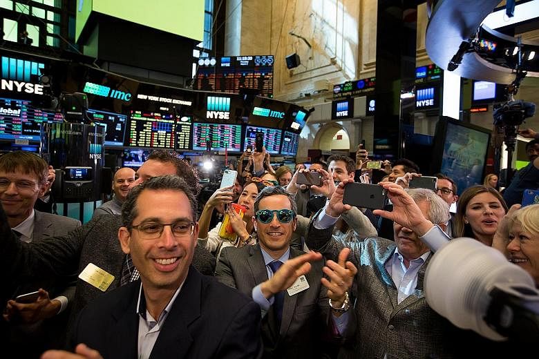 There's no better place to rock a pair of Snapchat Spectacles (Teal colour, centre) than on the floor of the New York Stock Exchange during the company's IPO on Thursday.