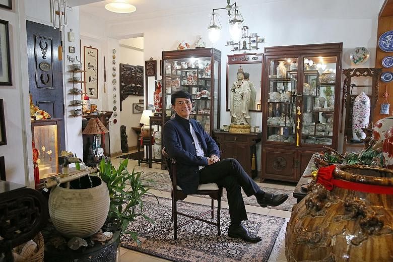 Mr Loo in his Landmark Tower apartment, which is filled with pieces of Chinese artwork and antiques that adorn its corners and walls, giving it an oriental aesthetic. The tower is located near major expressways, Outram Park MRT station, Singapore Gen
