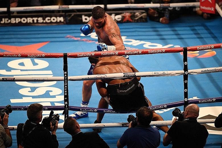 Tony Bellew pinning fellow Briton David Haye against the ropes. He upset the odds to put himself in contention for a title shot.
