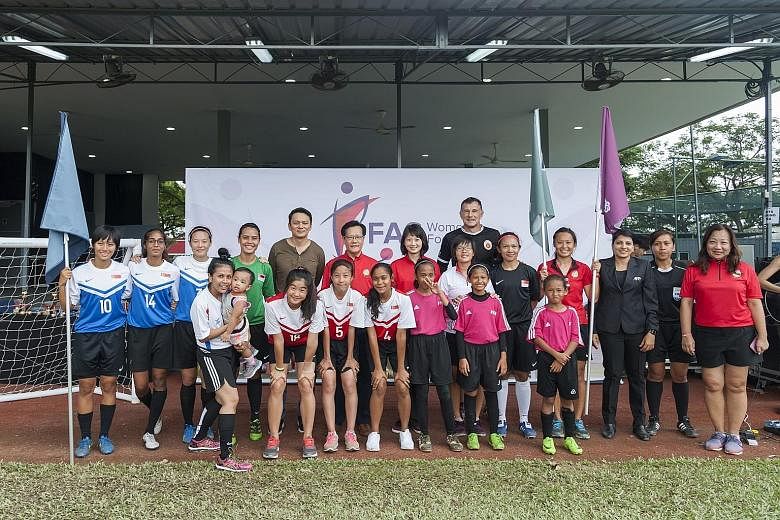The third Women's Football Day was held at the Kallang Field yesterday, during which the Football Association of Singapore launched the new FAS Women's Football logo. Ms Sun Xueling (back row, seventh from left), a Member of Parliament for Pasir Ris-