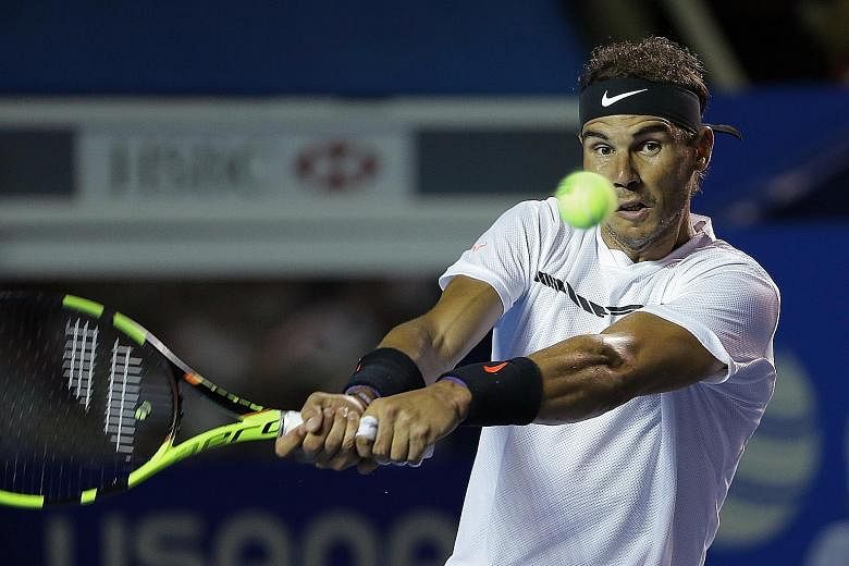 Rafael Nadal hitting a backhand against Sam Querrey in the final of the Mexican Open. The former world No. 1 entered the title decider without dropping a set in his 14 previous matches in Acapulco.