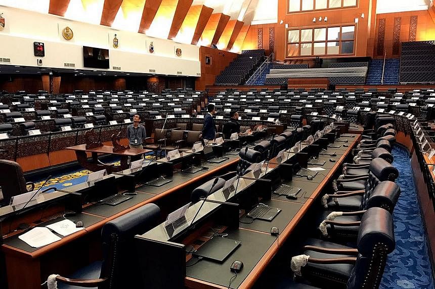 The newly refurbished Dewan Rakyat in Malaysia's Parliament Building. The parliamentary session which begins today is likely to be the final one before the next general election, which many expect to be called this year. Demonstrators at a rally in s