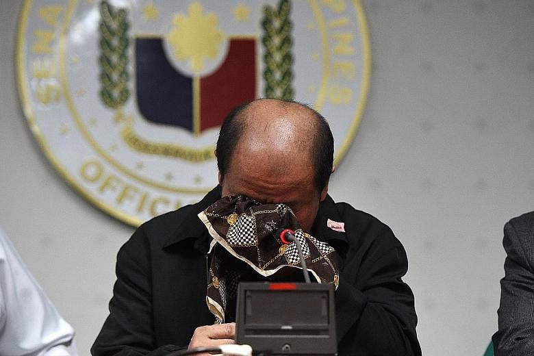 A tearful Mr Lascanas speaking during a Senate press conference of his involvement in his brothers' killings. The former police officer says that he killed "almost 200" people while serving in the alleged "death squads" that President Duterte purport