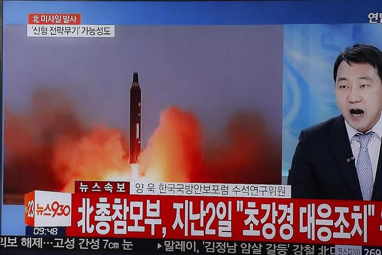 A report on the North Korean missile tests being broadcast on TV in Seoul yesterday. The North's ally China slammed the tests but also put part of the blame on US-South Korea drills that began last week.