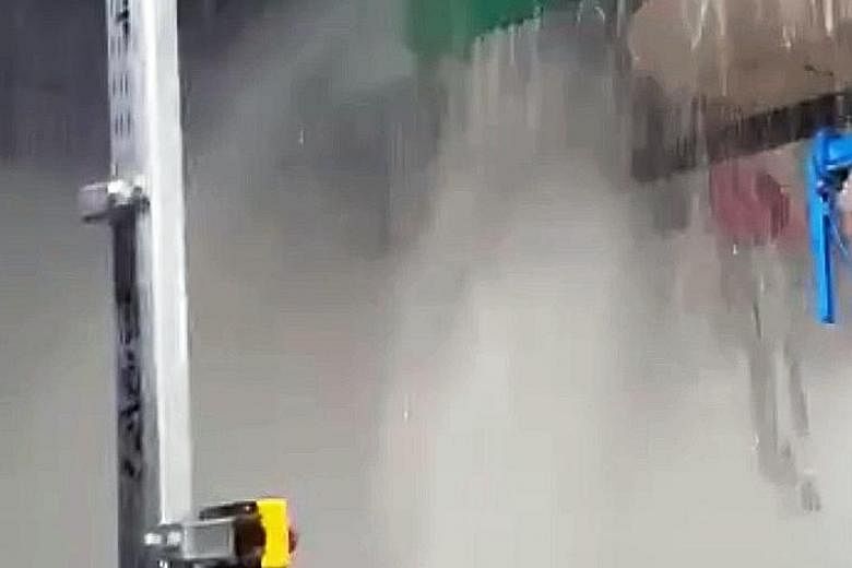 Still images from a video provided by a Straits Times reader show water gushing from a defective water pipe (above) in the yet-to-open Bencoolen MRT station and pooling. The fault has since been rectified.