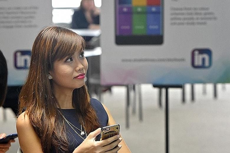 Pasir Ris Secondary teacher Ms Ho says she likes being able to access past IN issues on the mobile app. Those who attended the invitation-only launch event yesterday got to try out the features of the new mobile app for IN. With the new app, the week