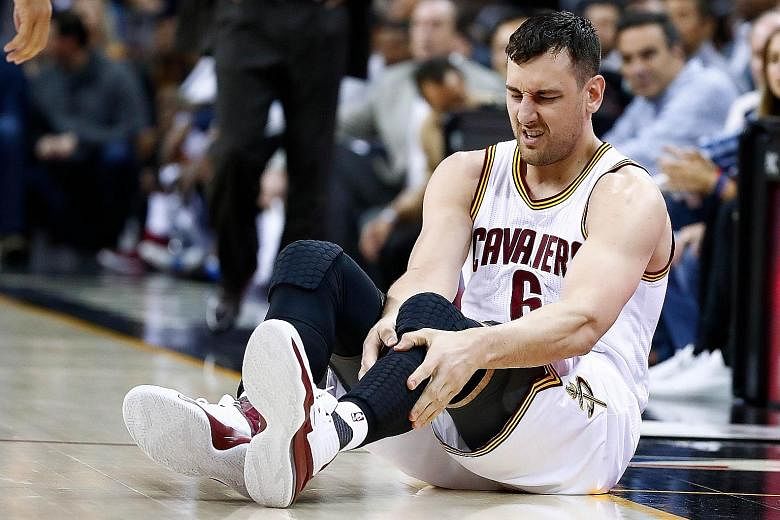 Andrew Bogut of the Cleveland Cavaliers after fracturing his left tibia in a collision with Miami Heat's Okaro White. Ironically, the veteran centre was signed as a free agent by the Cavs last week because of concerns over the champions' growing inju